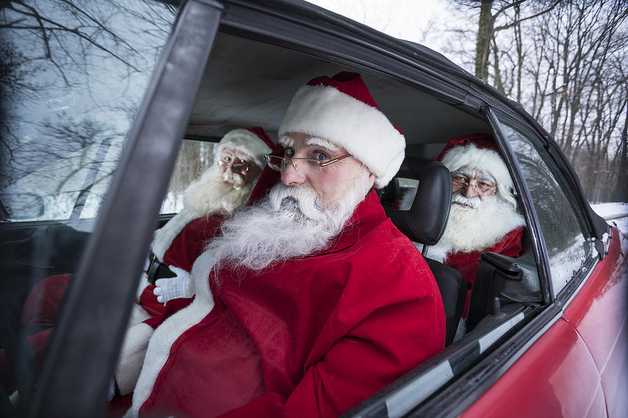 Santas at car Photograph by Vesnaandjic