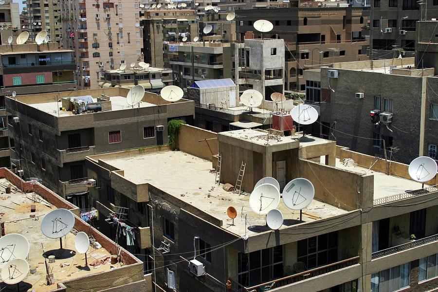 Satellite Dishes On City Rooftops Photograph by Peter Menzel/science Photo Library