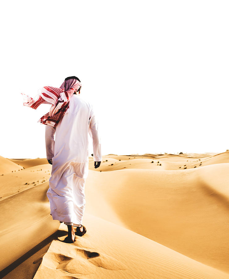Saudi Arabian Sheik walking on the desert Photograph by Franckreporter