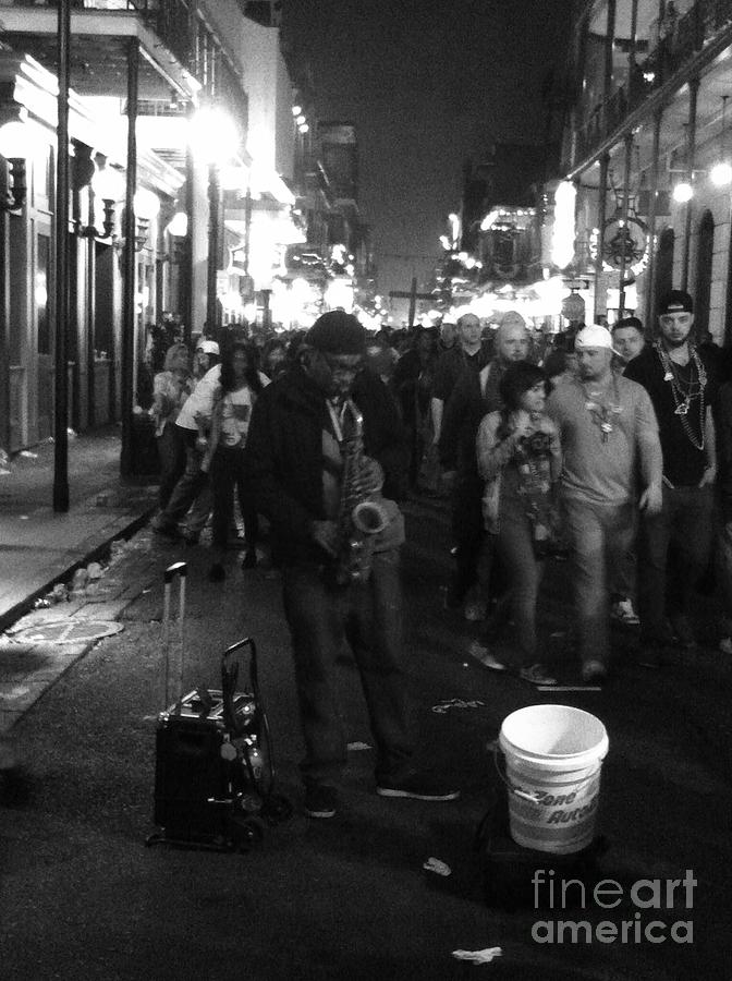 Sax player on Bourbon Street Photograph by WaLdEmAr BoRrErO