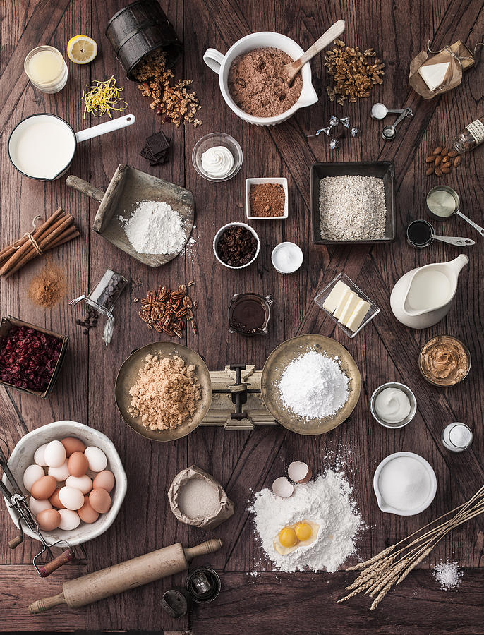 Scale and baking ingredients on wooden table Photograph by Manny Rodriguez