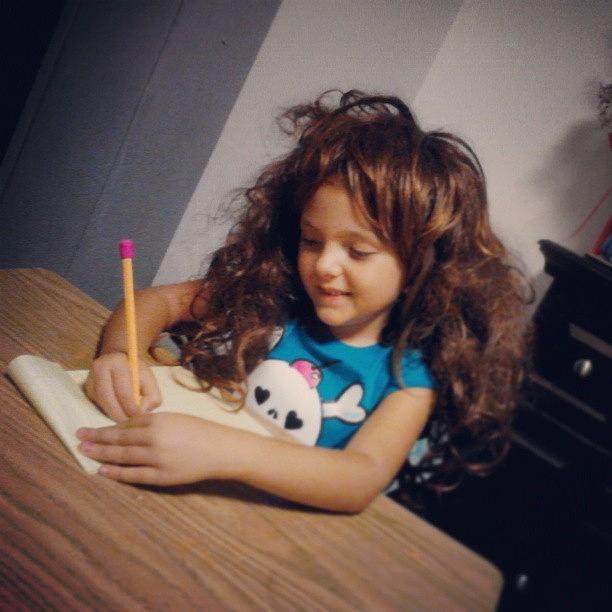 Scarlet, Wearing A Crazy Wig, Writing A Photograph by Jessica Rice