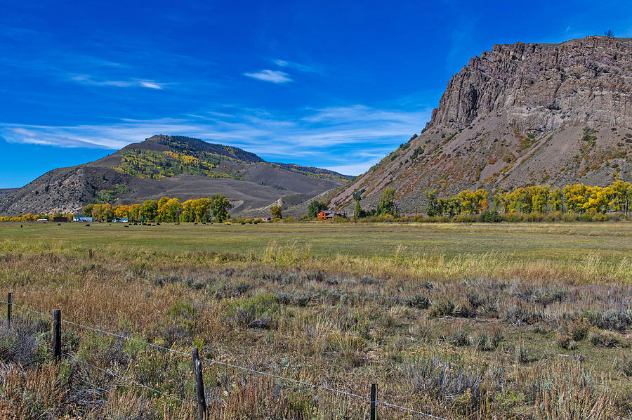 Scenic Farm House With Grazing Cows and Pasture Between Mountains in Northern Colorado Photograph by Willie Harper