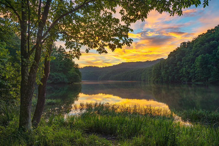 Scenic summer sunset over calm mountain lake Photograph by Aheflin