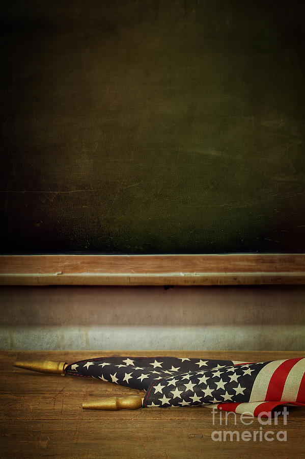 School blackboard with American flag on desk Photograph by Sandra Cunningham