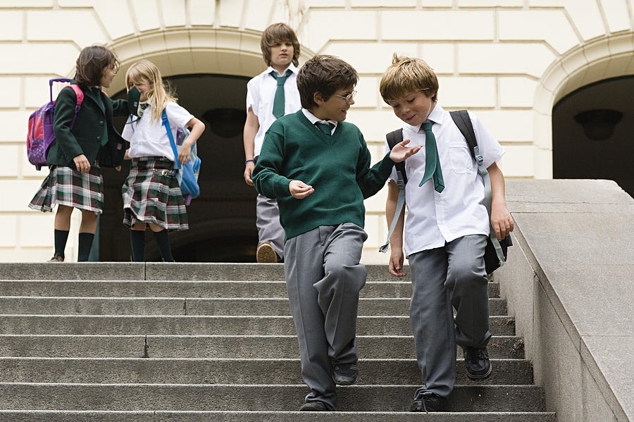 School children on steps Photograph by Image Source
