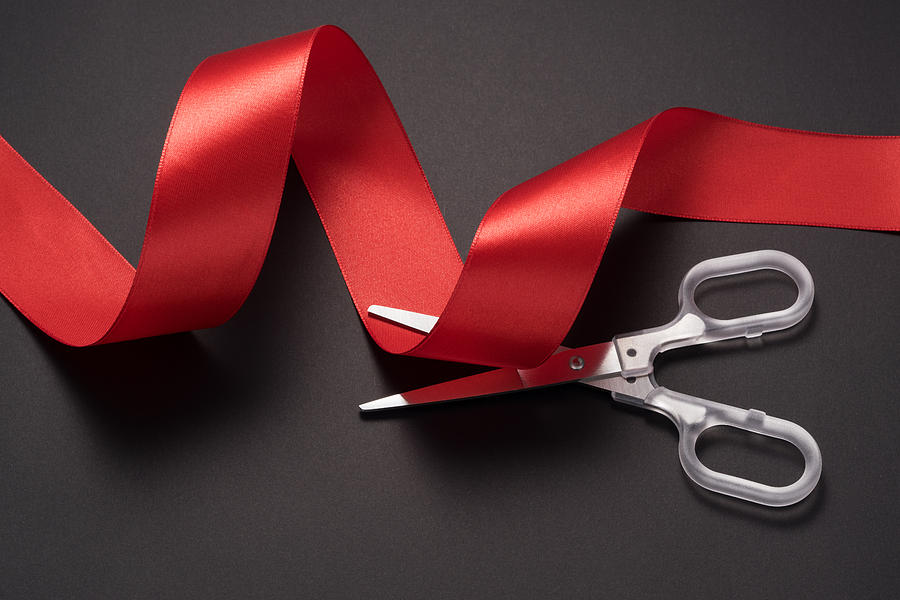 Scissors Cutting Red Ribbon Photograph by MirageC