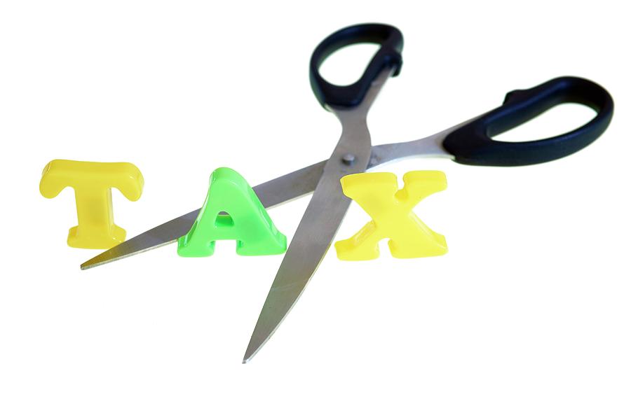 Scissors Cutting The Word Tax Photograph by Ian Hooton/science Photo Library
