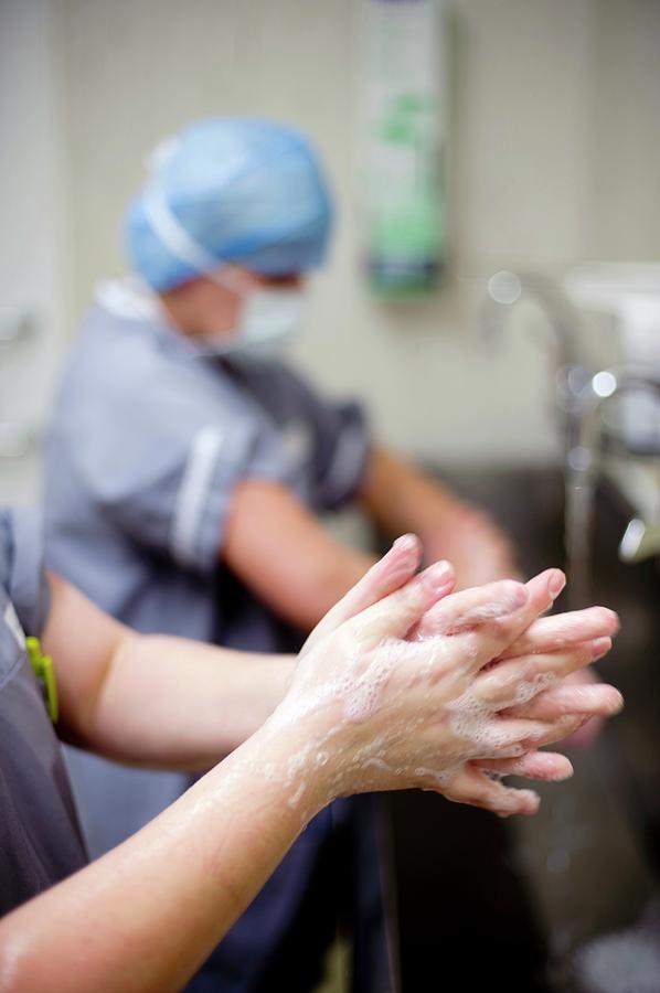 Scrubbing Up Before Surgery Photograph by Jim Varney/science Photo ...