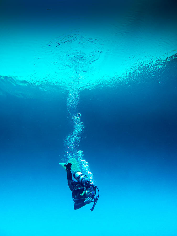 Scuba Diver decompressing during the immersion Photograph by Creative Frame Studio
