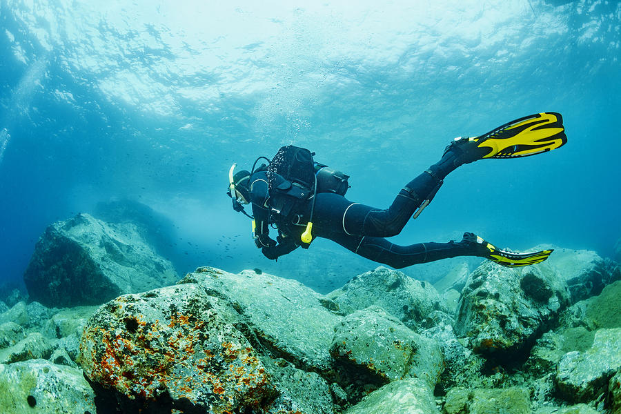 Scuba diving    Underwater  scuba diver in blue lagoon Photograph by Ultramarinfoto
