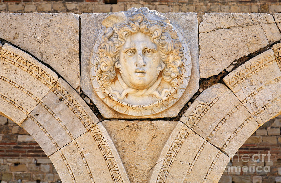 Architecture Photograph - Sculpted Medusa head at the Forum of Severus at Leptis Magna in Libya by Robert Preston