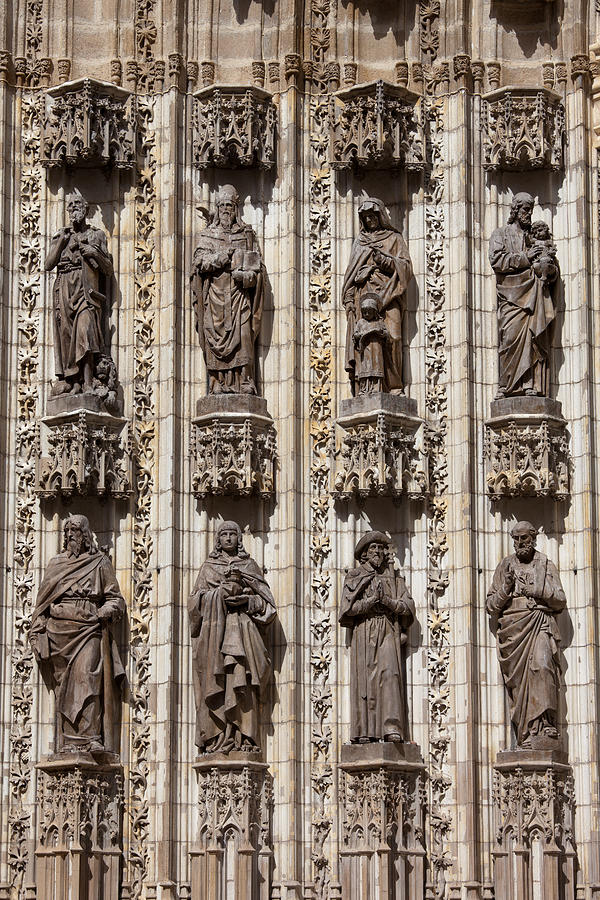Sculptures of Saints on Seville Cathedral Facade Photograph by Artur Bogacki