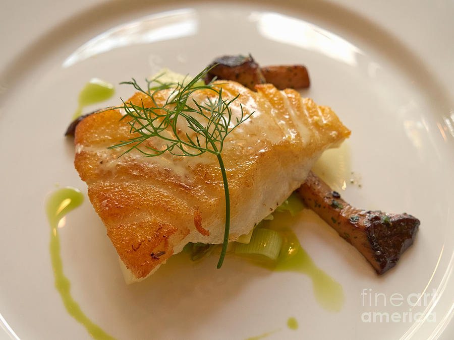 Sea Bass with trumpet mushrooms leeks and absinthe cream Photograph by Louise Heusinkveld