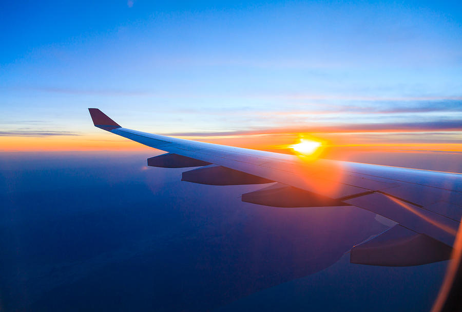 Seeing the sunset on flight Photograph by Serts