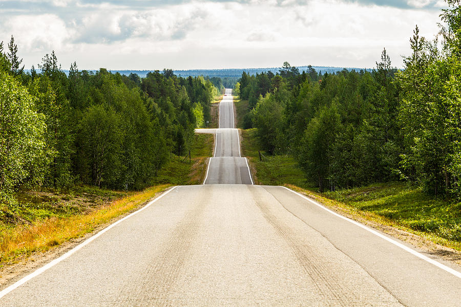 Seesaw road in Finland Photograph by Marc Espolet Copyright