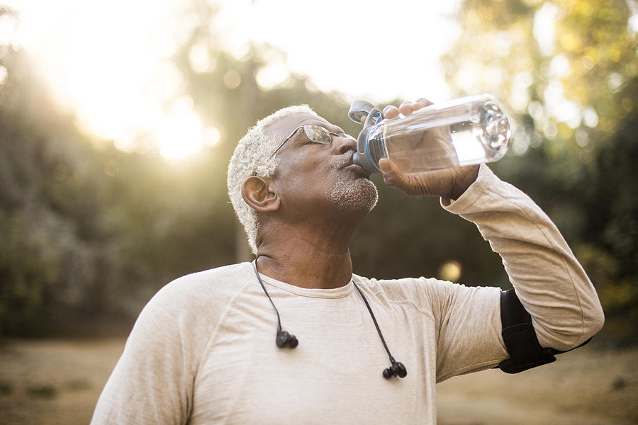 Senior African American Man Drinking Water Photograph by Adamkaz