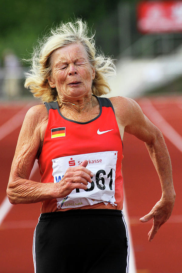 Senior Athlete Runs Through The Pain Photograph by Alex Rotas