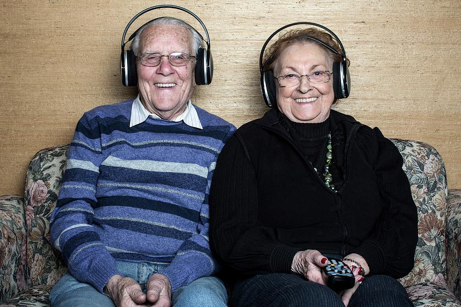 Senior Couple Wearing Headphones Photograph by Mauro Fermariello