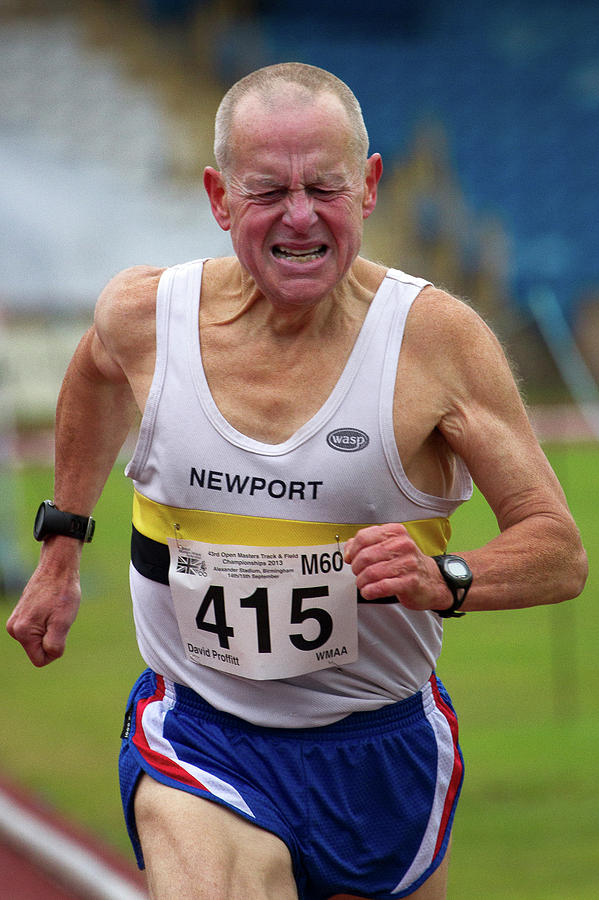 Senior Male Athlete Runs Through The Pain Photograph by Alex Rotas