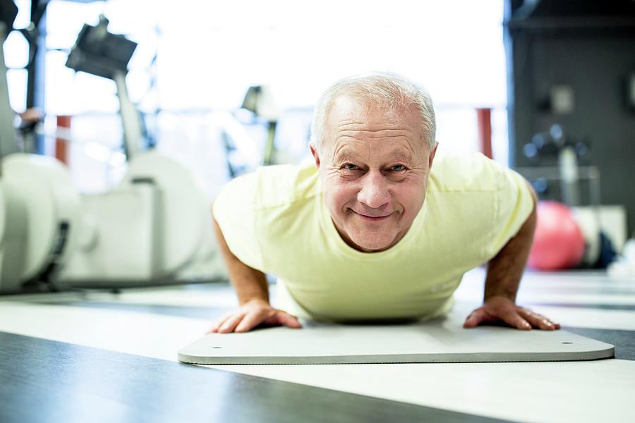 Senior Man Exercising In Gym Photograph by Science Photo Library