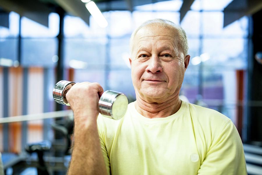 Senior Man Holding Dumbbell Photograph by Science Photo Library