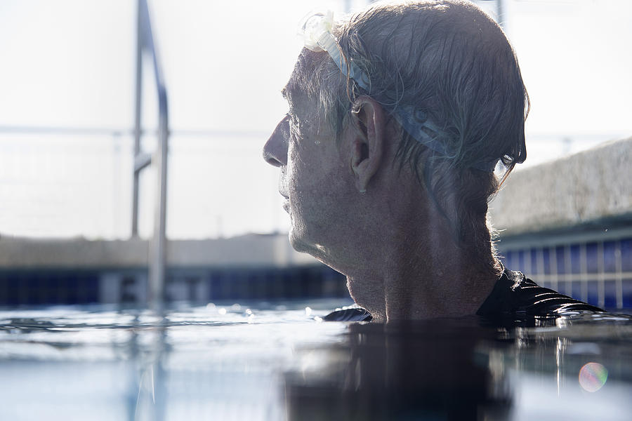 Senior man in swimming pool Photograph by Gary John Norman