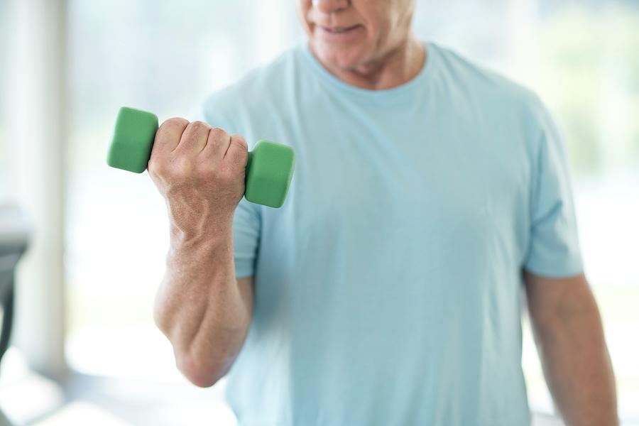 Senior Man Using Weights Photograph by Science Photo Library