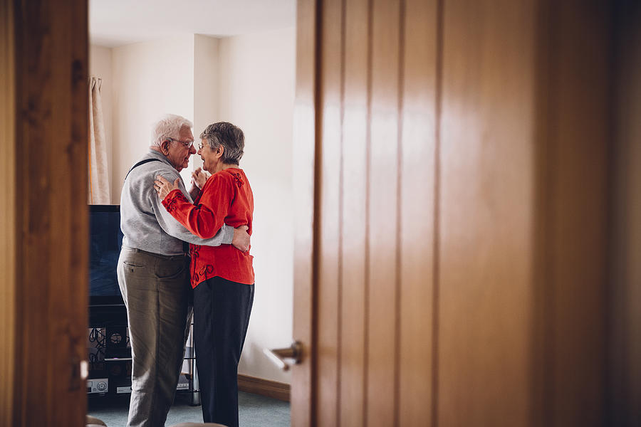 Senior Tenderness as they Dance in their Home Photograph by SolStock