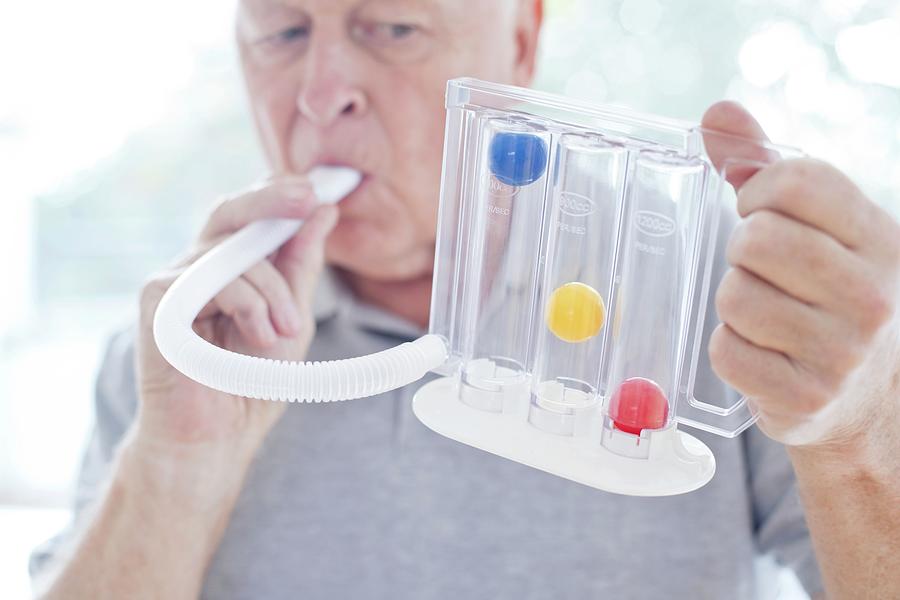 Senior Using Incentive Spirometer Photograph by Science Photo Library