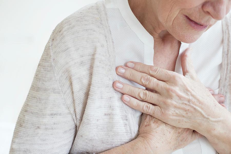 Senior Woman Holding Chest Photograph by Science Photo Library | Fine ...