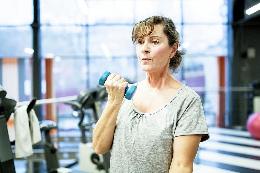 Senior Woman Holding Dumbbell Photograph by Science Photo Library