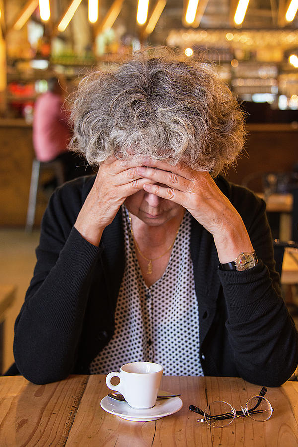 Senior Woman In Cafe With Head In Hands Photograph by Science Photo Library Senior Woman In Cafe With Head In Hands Photograph by Science Photo Library