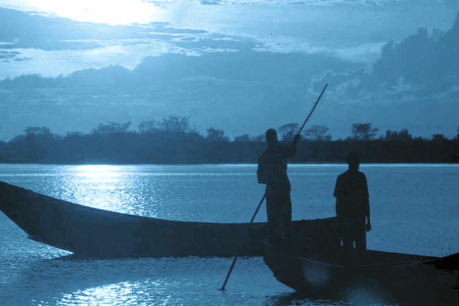 Boat Photograph - Serenity of the nature in Congo 2 boat men calling it a day at the sunset who knew it could be so pe by Navin Joshi