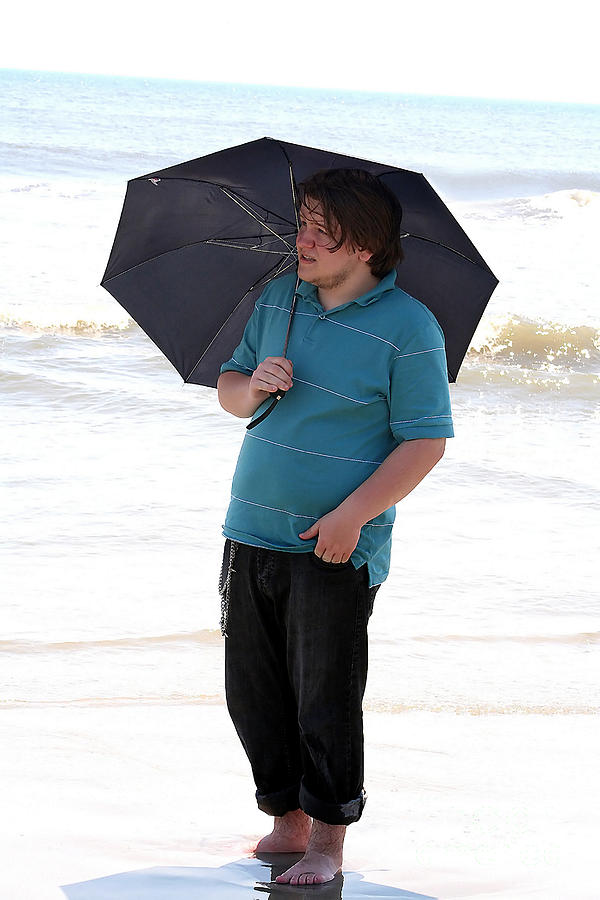 Serious Boy With Umbrella In Surf Photograph by Susan Stevenson