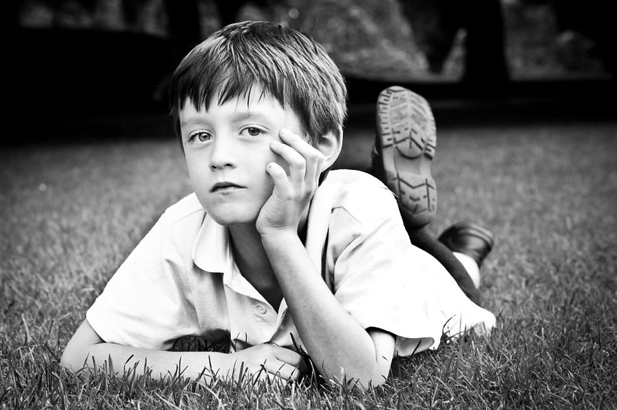 Black And White Photograph - Serious child by Tom Gowanlock
