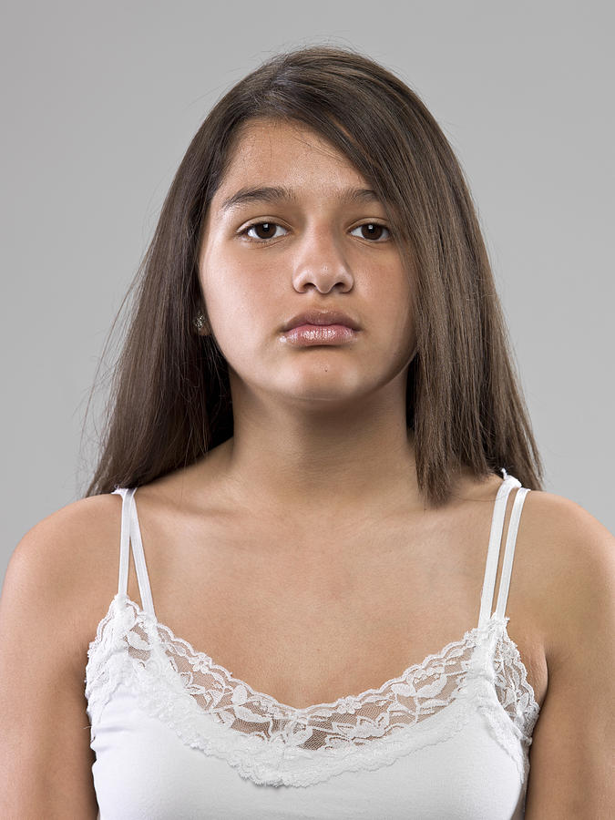 Serious thirteen years old hispanic girl Photograph by Juanmonino