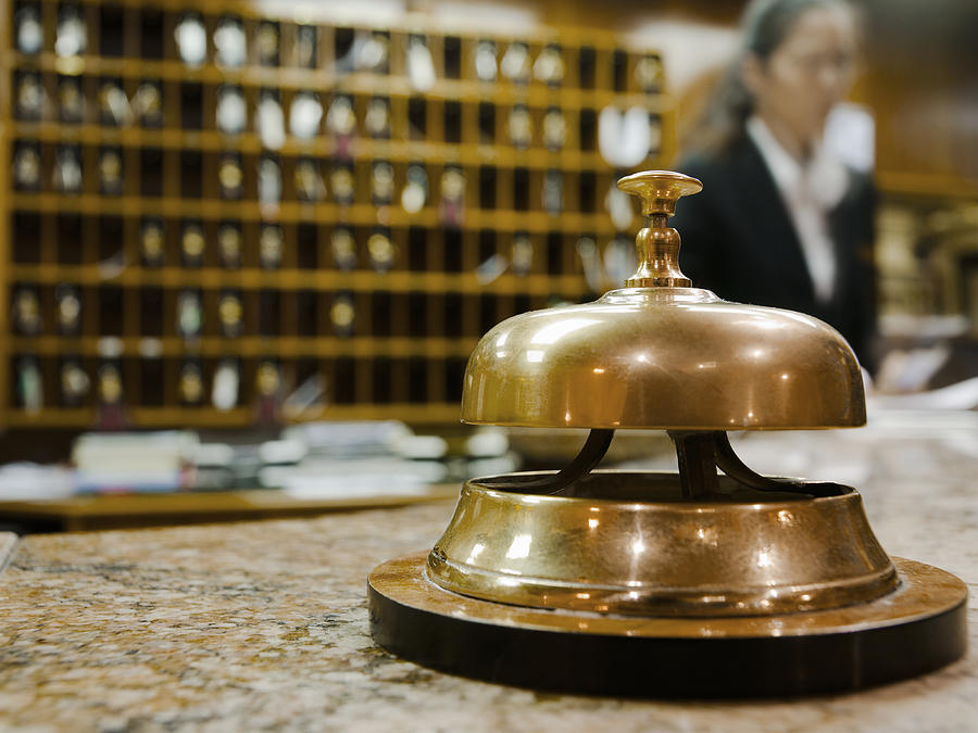 Service bell at hotel reception Photograph by Louis Fox