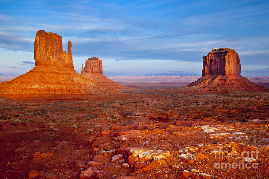 Setting sunlight over the Mittens in Monument Valley Photograph by Brian Jannsen