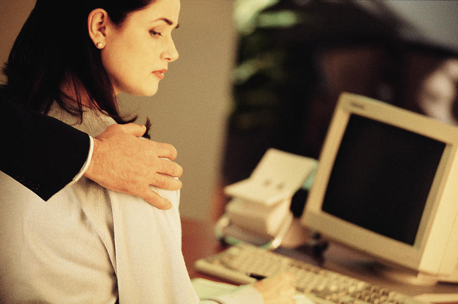 Sexual harassment in the workplace Photograph by Comstock