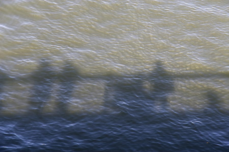 Shadow Photograph - Shadow of people standing on the bridge over the river Main in Frankfurt am Main Germany by Ronald Jansen