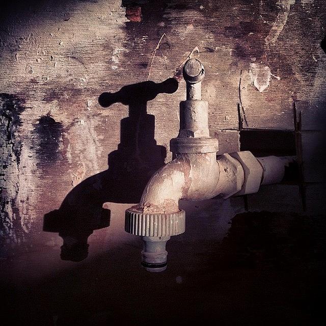 Shadow Tap Photograph by Norbert Cristia