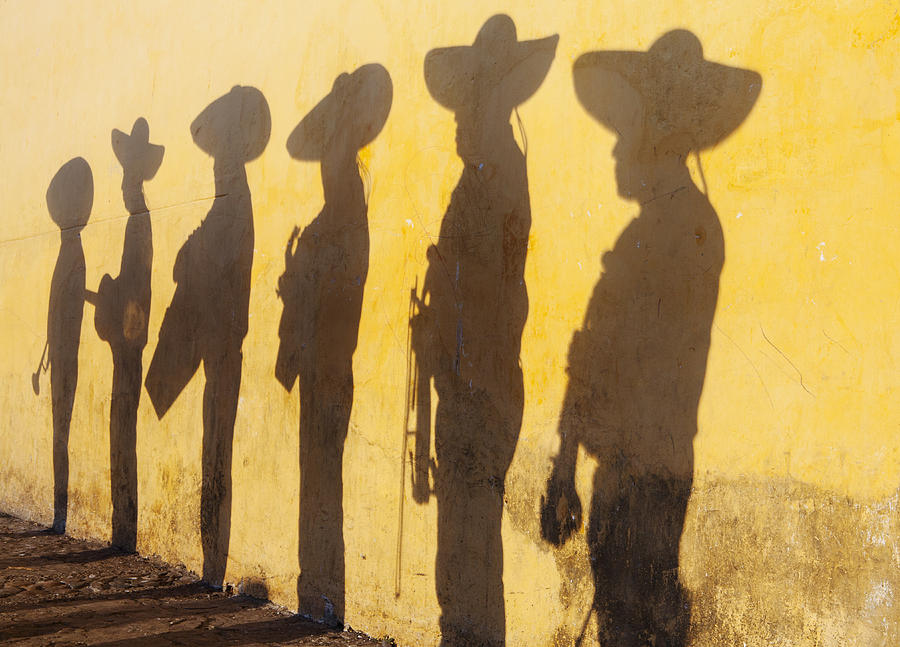 Shadows of mariachi band members Photograph by Holly Wilmeth