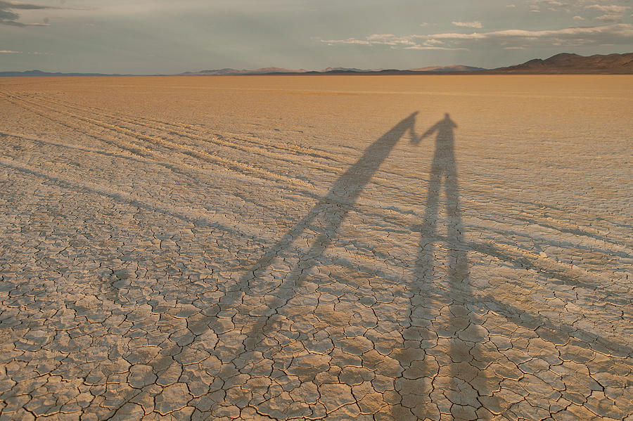 Shadows Stretch Across The Black Rock Photograph by Michael Okimoto Shadows Stretch Across The Black Rock Photograph by Michael Okimoto
