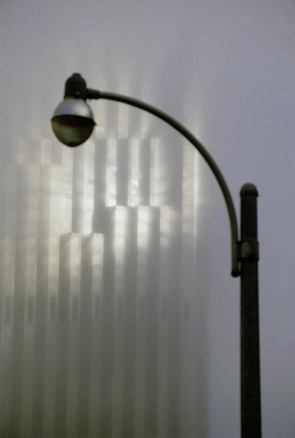 Shaft Of Sunlight In Fog With Streetlamp Photograph by David Parker/science Photo Library