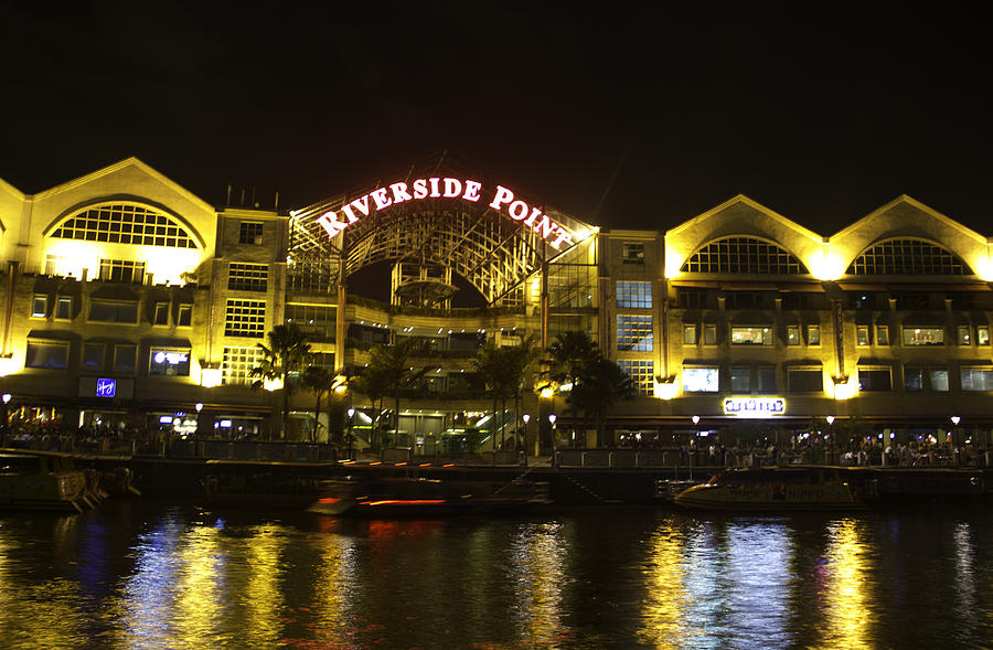 Shimmer of the water at Clarke Quay in Singapore Photograph by Ashish Agarwal