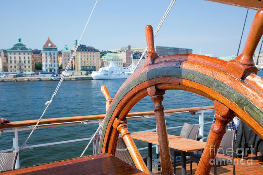 Ship helm and a view on Stockholm Photograph by Michal Bednarek
