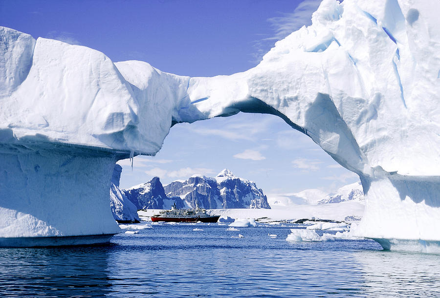 Ship Through Arch Of Iceberg Photograph by George Holton