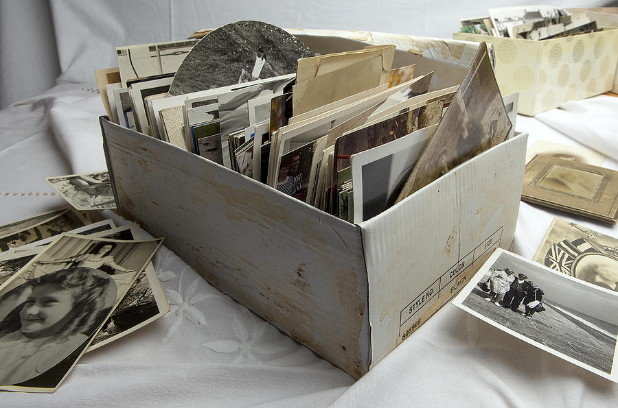 Shoe box of old family photographs Photograph by Image Makers