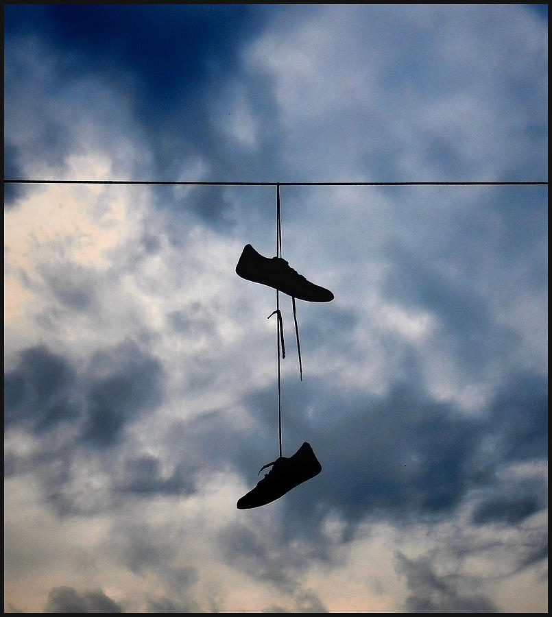 Shoes on a Wire Photograph by Jeffrey Platt